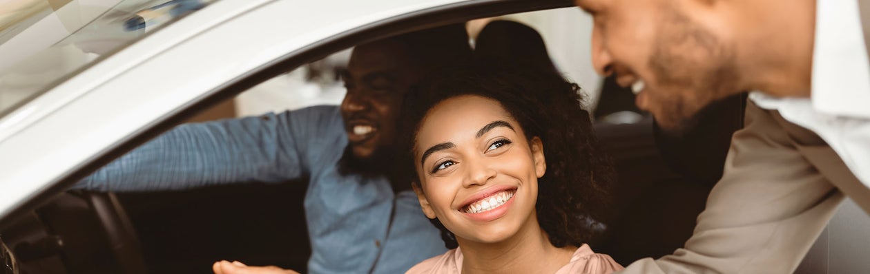 Young driver working with salesperson